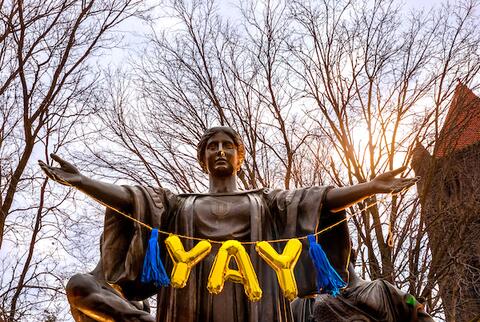 The Illinois Alma Mater statue with the word "Yay" in front of it